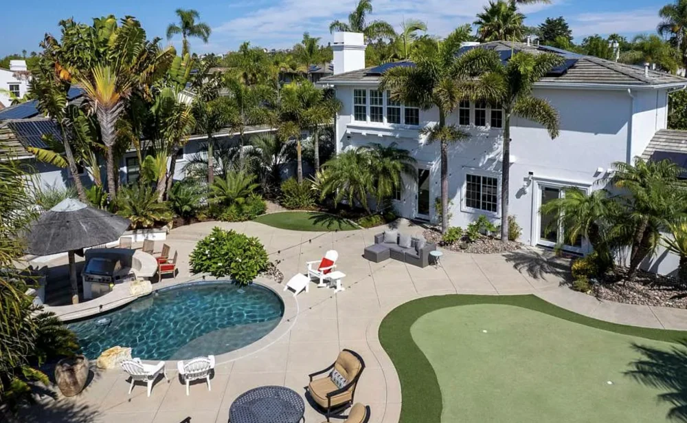 Luxury Estate Backyard Retreat with a Pool, Spa, Putting Green and Lounge Areas